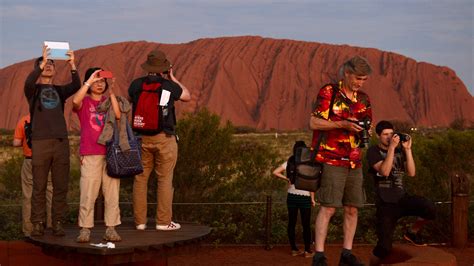 Tourists rush to climb Australia's Uluru on final day before ban | BT