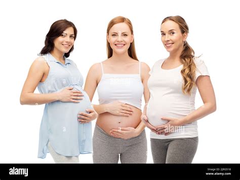 Happy Pregnant Women Touching Their Big Bellies Stock Photo Alamy