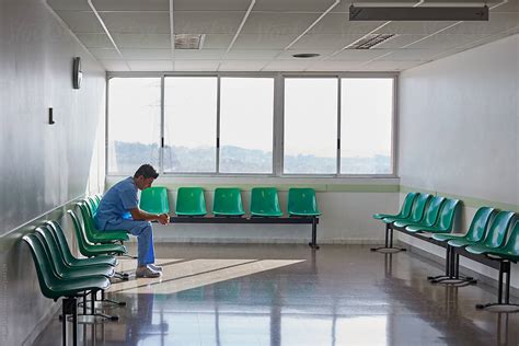 Doctor Resting Alone In A Hospital Waiting Room By Miquel Llonch