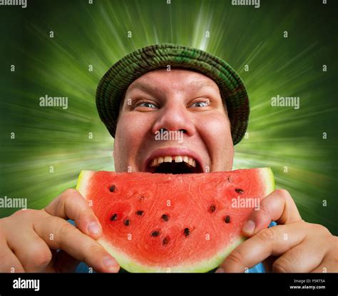 Bizarre man eating watermelon outdoors in summer Stock Photo - Alamy