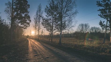 Winter Landscape Of Sunset Over The Country Road With