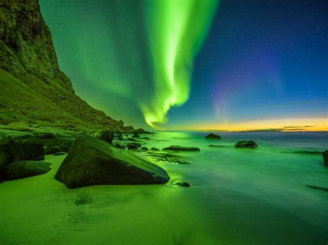 Beach In The Lofoten Islands In Norway With Strong Green Northern