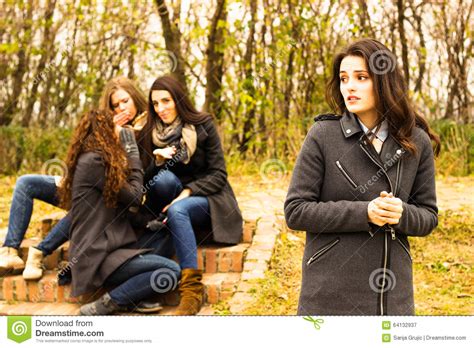 Sad Girl With Friends Gossiping In Background Stock Image Image Of