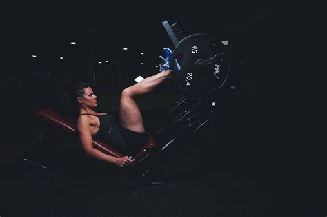 Fit Woman Doing Leg Press Exercise In The Gym High Quality Free Stock