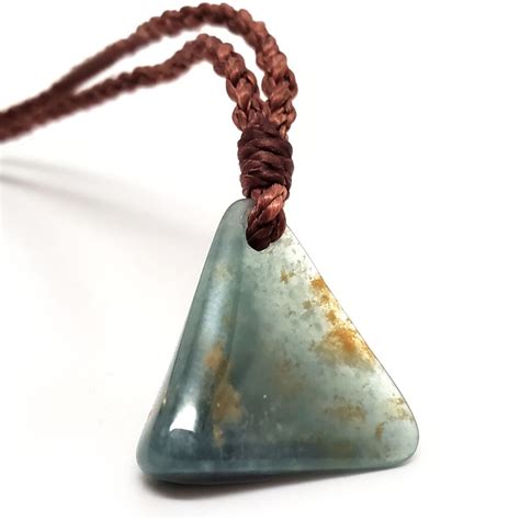 Jade Triangular Drilled Pendant With Braided Rope The Fossil Cartel