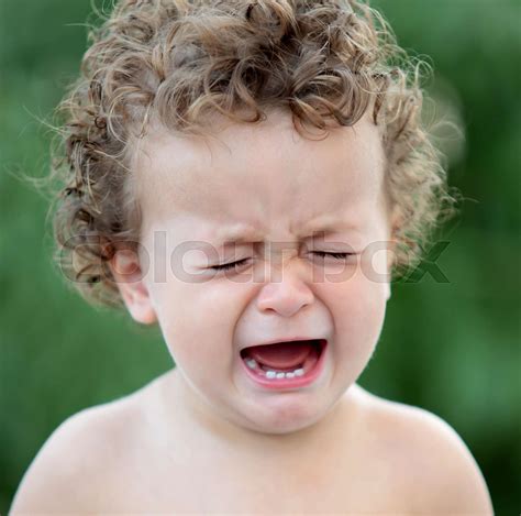Sad Baby With Curly Hair Crying Stock Image Colourbox