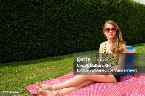 Girl Sunbathing In Backyard Stock Photo Getty Images