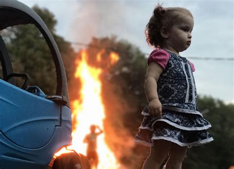 Photo Of Girl Standing Stoically By Fire Is The Latest And Greatest Internet Meme Houston