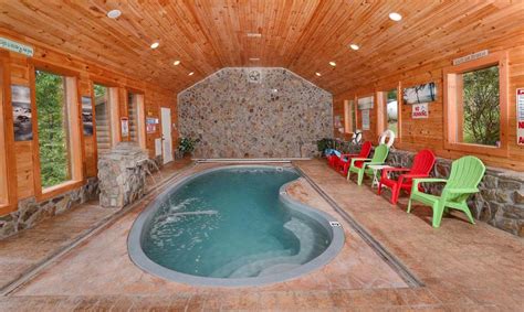 Our gatlinburg cabins and pigeon forge cabin rentals in tennessee have amazing mountain views, game tables, hot tubs and are next door to dollywood and pigeon forge shopping, restaurants, and fun attractions! Gatlinburg Cabin - Holiday Springs - Indoor Pool | Hot tub ...