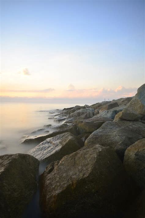 Morning Sunrise On Long Exposure With Stone Formation View Stock Photo