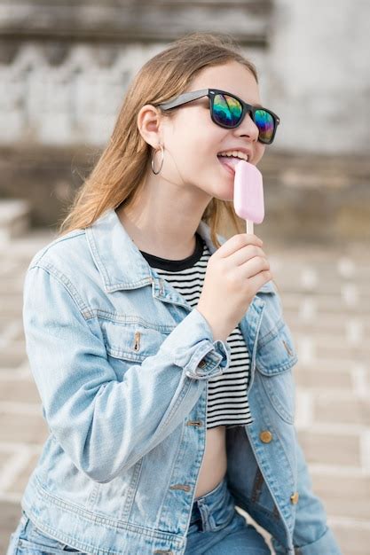 Free Photo Stylish Attractive Modern Girl Licking Tasty Ice Cream