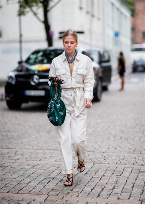 Go For A Utilitarian Look With A White Jumpsuit Strappy Sandals