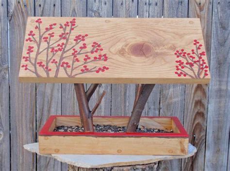 Using wood glue and 1 1/4″ wood screws, attach the 'lip' of your feeder between the two side boards and flush with the edge of your base. Wood Bird Feeder, 25 Design Ideas for DIY Garden Decorations