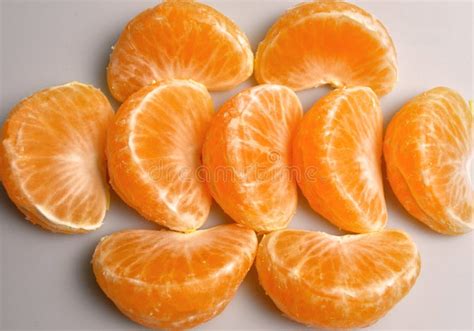 Orange Natural Mandarin Slices On A White Background Stock Image