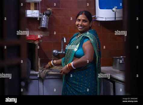 An Indian House Maid Working In The Kitchen Stock Photo Alamy