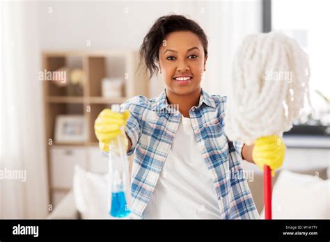 African American Woman With Mop Cleaning At Home Stock Photo Alamy