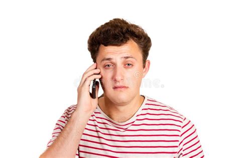 Young Man Crying Over The Bad News He Is Receiving On His Phone