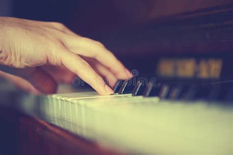 Woman Pianist Sits At The Piano And Beautiful Singer Stock Photo