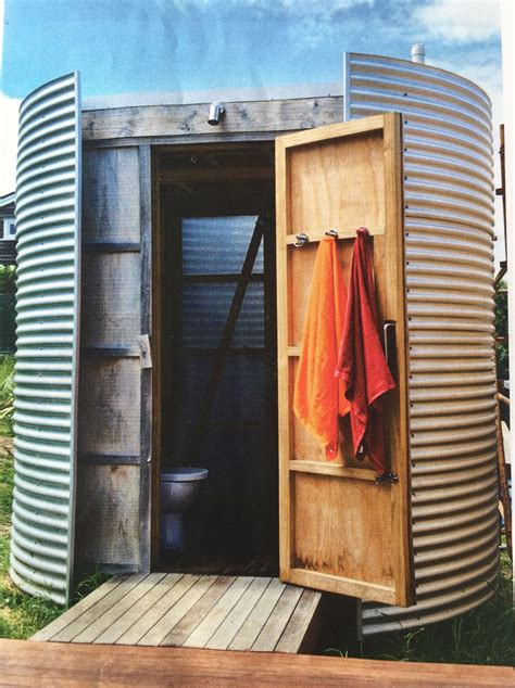 An Outhouse With A Towel Hanging On The Door