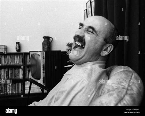 Warren Mitchell Has A Laugh At Home Stock Photo Alamy