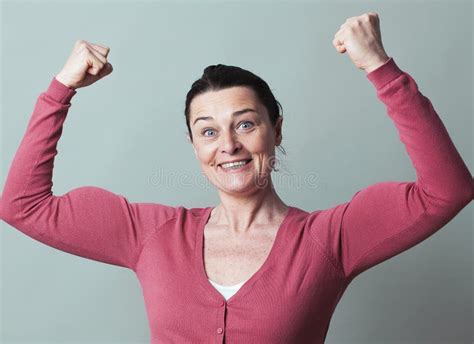 joyous beautiful 40s woman flexing her muscles up stock image image of excited manlike 64371361