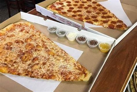 One slice of a large dominos supreme pizza is about 320 calories. little caesars pizza size inches