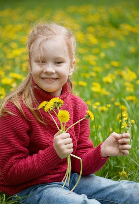 Little Girl And Meadow With Dandelions Summer Day Outdoors Stock Image