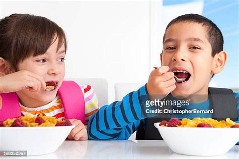 Children Eating Breakfast At School Photos And Premium High Res