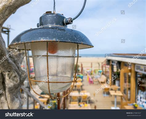 Old Industrial Lamp Beachclub Sea Background Stock Photo
