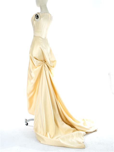 Vivienne westwood at the opening of the vivienne westwood exhibition at the v&a museum. Vivienne Westwood cream silk corset and draped skirt ...