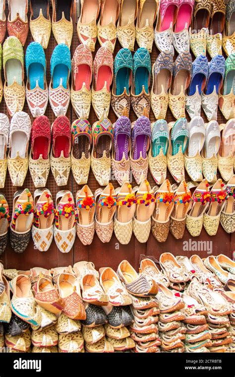 Shoe Vendor Displaying His Colorful Wares At One Of The Many Souks In Dubai United Arab