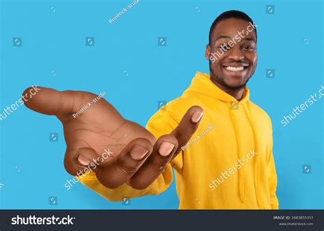 2 Happy Black Guy Showing Big Outstretched Hand Offering Help Taking