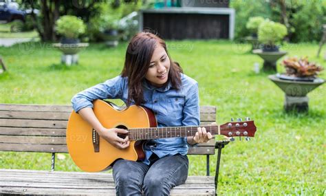 Beautiful Young Woman Playing Guitar Sitting On Bench Happy Time
