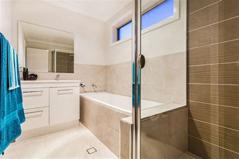 Because it's going to be used by some different people, a simple design of the room is going to be loved by everyone. A nice modern neutral bathroom idea. You can use towels to ...