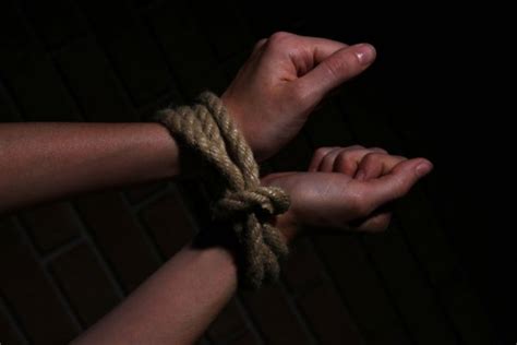 The Hands Of A Young Man Tied With Rope — Stock Photo © Nito103 91830194