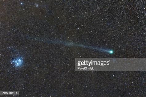 Conjunction Of Comet C2014 Q2 And Star Cluster M45 High Res Stock Photo