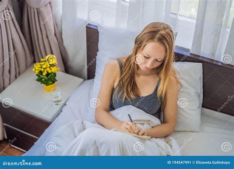 Woman Writing Diary Or Studying In Bed Thinking Stock Image Image Of