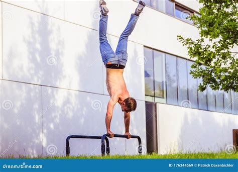 Workout In Summer Young Fit Caucasian Man Is Doing A Handstand Stock