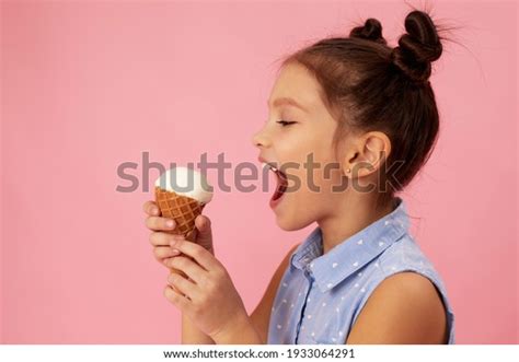 Cute Smiling Little Girl Eating Vanilla Stock Photo Edit Now 1933064291