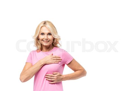 Blonde Woman Looking At Camera While Touching Breast Isolated On White