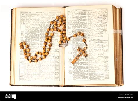Rosary On Bible Isolated Stock Photo Alamy