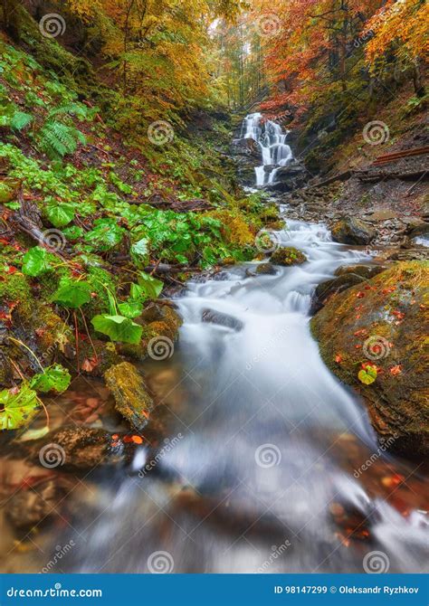 Beautiful Waterfall At Mountain River In Colorful Autumn Forest Stock