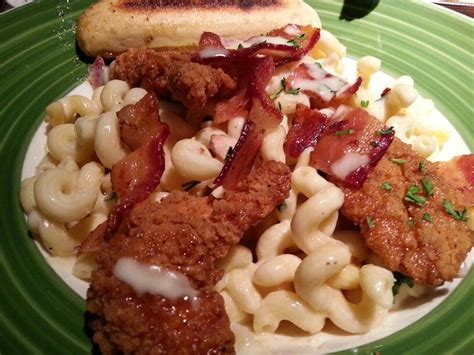 Honey Chicken Tenders Over Mac And Cheese With Bacon And Garlic Bread