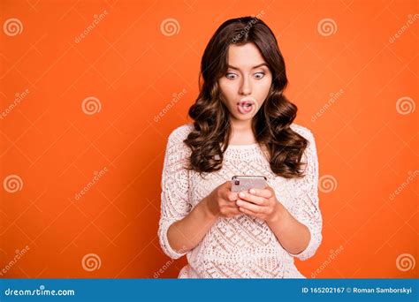 portrait of amazed crazy girl addicted blogger use smartphone read social network news impressed