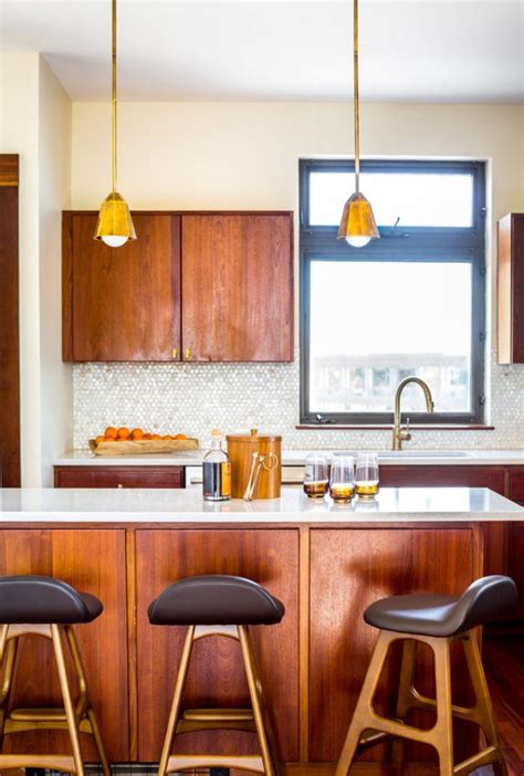 Modern kitchen with stunning lighting in traditional home. 15 Beautiful Mid-Century Modern Kitchen Interior Designs