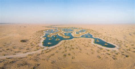 Aerial View Of Big Oasis In The Middle Of Desert Landscape Uae