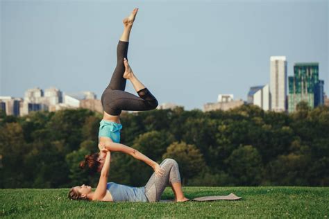 From a seated position facing each other, extend legs out exhale as one person folds forward from the hips and the other sits back, keeping the spine and arms straight. Best 90 partner yoga poses for two people (Acro Yoga)