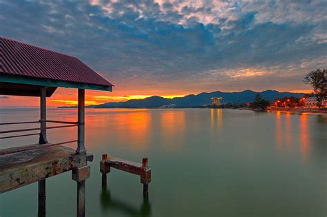 Sky Clouds Sunset Mountains Lake House Lights Pier Wallpapers Hd