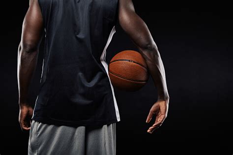 African Basketball Player With A Ball In His Arm Stock Photo Download