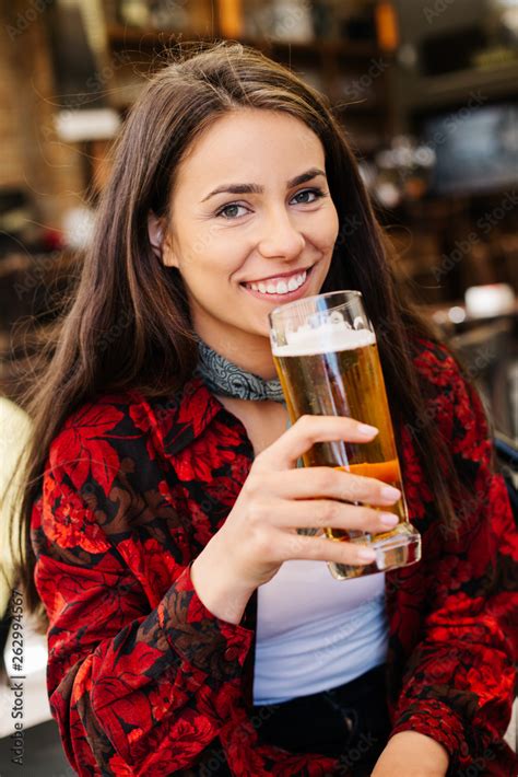 Girl Having A Beer While Waiting For A Friend Long Haired Woman Drinking Beer At A Bar Girl In